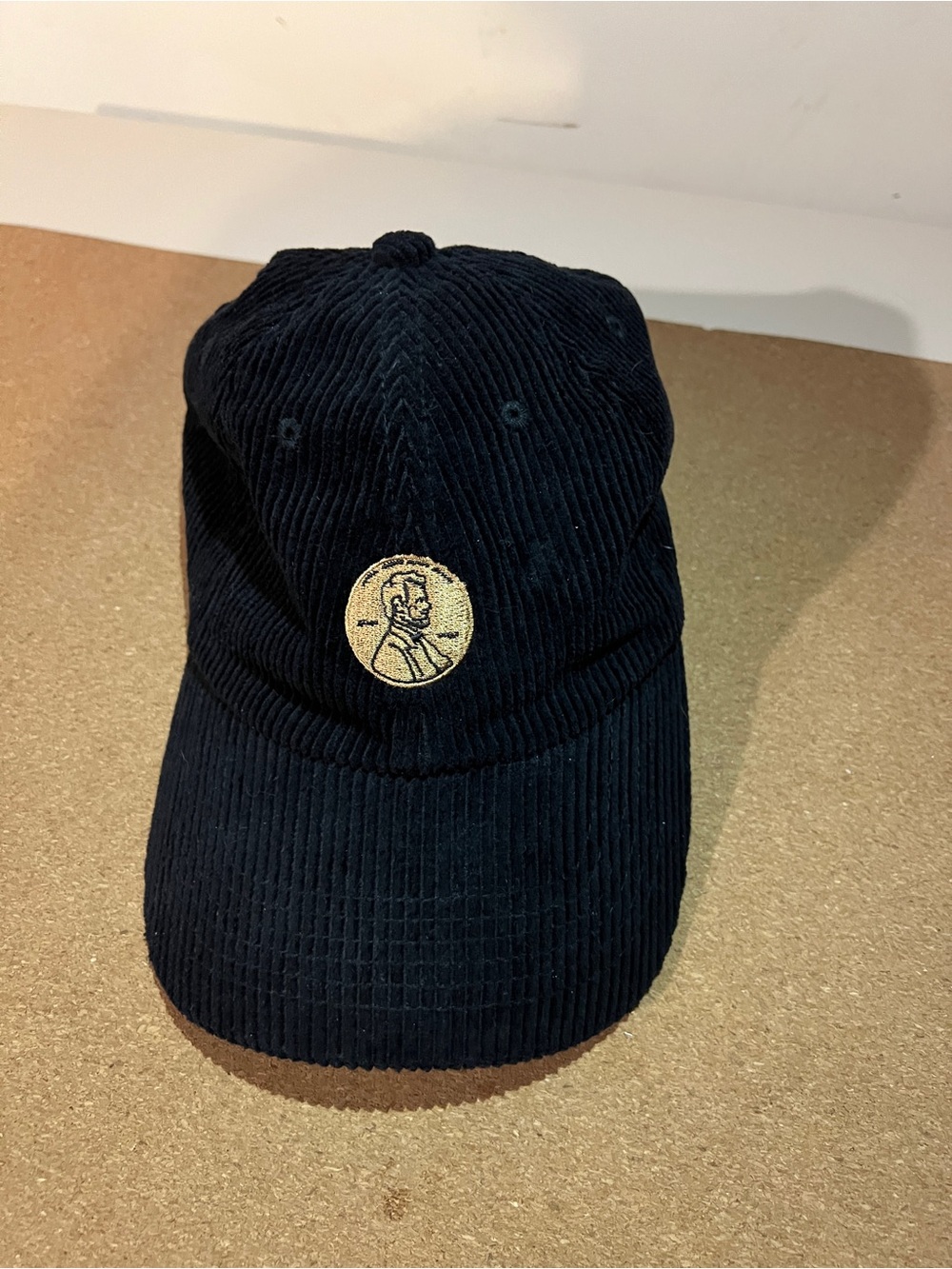 Men's Black Corduroy Cap with Gold Embroidered Medallion - make it make cents